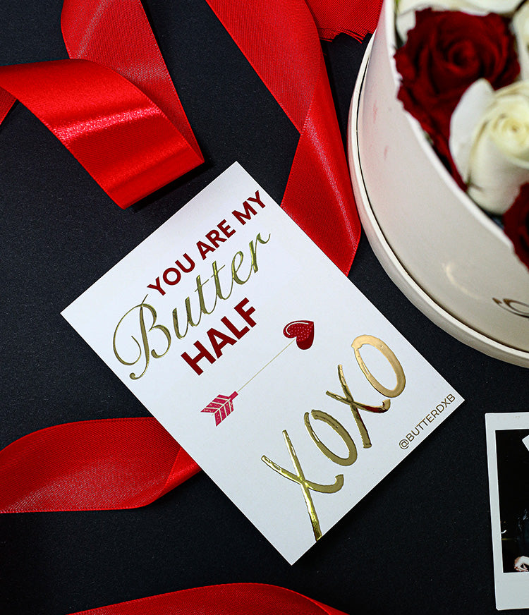 The gold-foiled card features the heartfelt message “You are my BUTTER half” in elegant script, finished with a playful xoxo kiss symbol. The metallic sheen adds a touch of luxury and warmth, making it a charming keepsake your loved one will treasure.