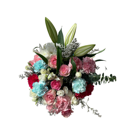 A round matte white box filled with a fresh floral arrangement featuring roses, baby roses, carnations, lilies, and lavender in soft pastel hues.